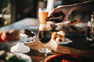Craft beer with croissants and cake